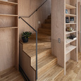 コンパクトな回り階段。手摺は細身のスチールフラットバー。