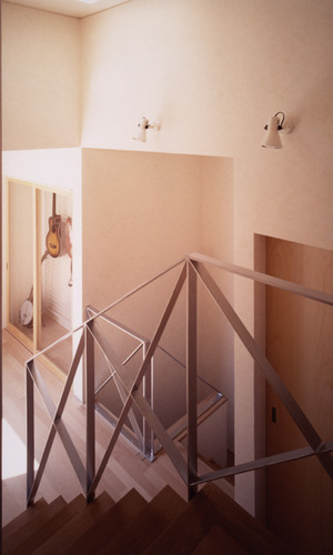 優しい木使いの空間に、ステンレスの手すりで引き締めた階段周り